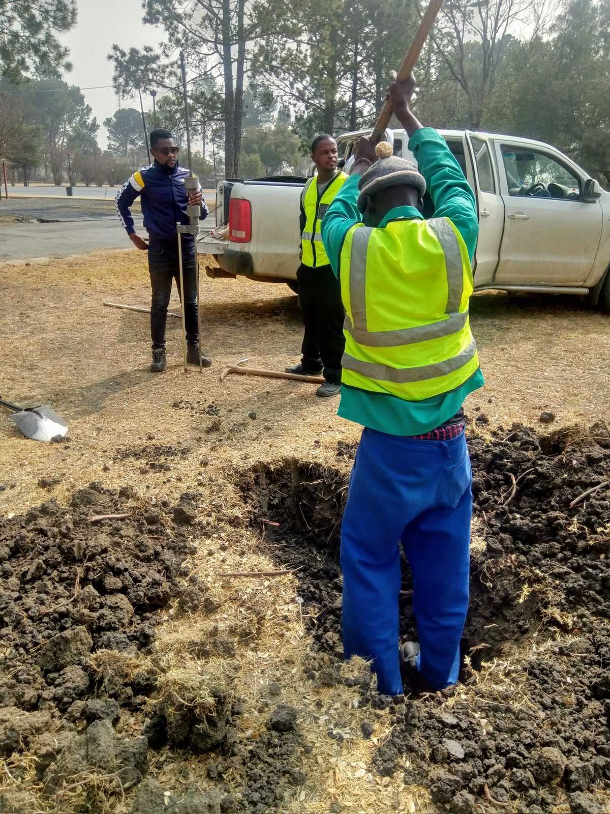 Mbozisi team working on site surveying and ground preparation